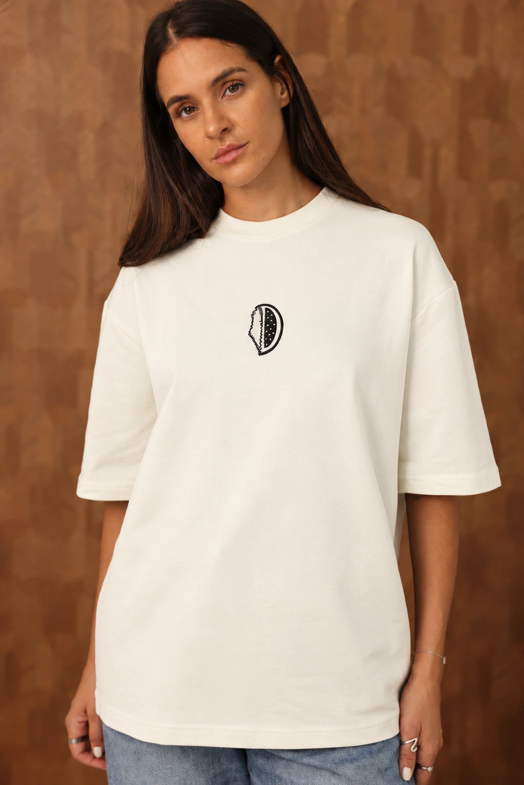 The Voice Off White T shirt on female model with black chest embroidery, AI edited colourway visualization